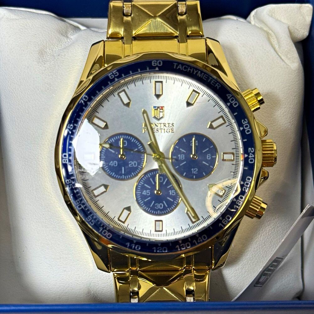 Montres Prestige Menโs Gold Band W/Blue & Silver Bezel 44mm w/Box